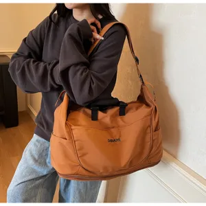 Large capacity brown travel duffel bag with shoulder strap for sports, fitness and business.