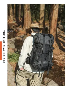 Detailed outdoor hiking backpack view with durable grid fabric and 55L capacity in forest.