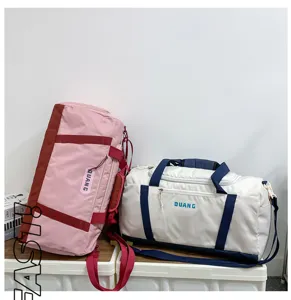 Large capacity travel duffel bag for gym, fitness, and sports with wet dry separation.