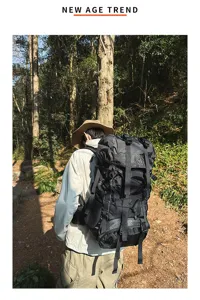 Detailed view of the 55L outdoor hiking backpack, durable grid fabric with multiple straps.