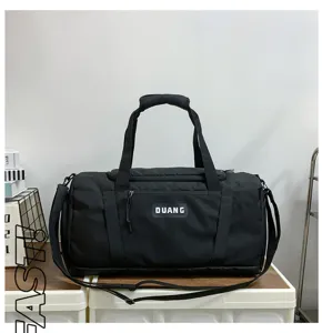 Large capacity black gym duffel bag for sports, travel, and fitness with dry wet separation.
