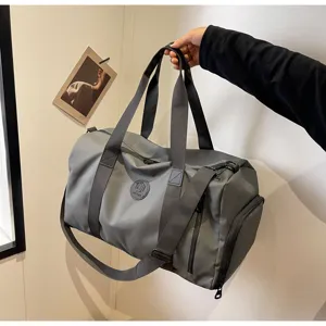Grey sports duffel bag with shoe compartment, large capacity travel luggage bag for men.