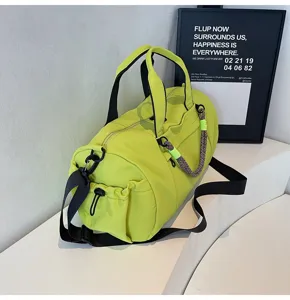 Fluorescent green gym duffel bag detail, large capacity sports travel bag for fitness and yoga.