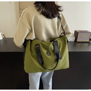 Large capacity green canvas travel bag, casual shoulder bag for gym, yoga, and luggage storage.