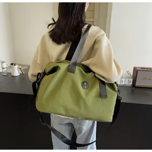 Green casual travel duffle bag with black shoulder strap, large capacity fitness bag.
