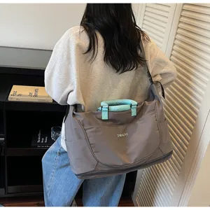Large capacity travel duffel bag fitness gym shoulder bag detailed view for women.