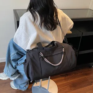 Large capacity sports duffel bag for gym, yoga, and short travel with braided handle.