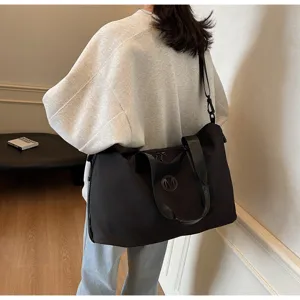 Large capacity black travel duffel bag with shoulder strap, casual gym fitness luggage bag.