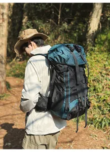 Outdoor hiking backpack detail shot, showing 55L large capacity, durable fabric and multiple straps.