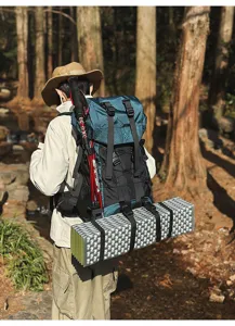 Professional outdoor mountaineering backpack, large capacity hiking and camping gear with poles.