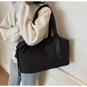 Large capacity black travel duffel bag, stylish fitness gym bag designed for casual daily use.