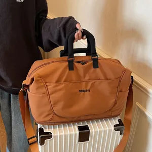 Large capacity brown travel duffel bag with shoulder strap for short trips and fitness.