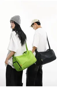 Waterproof sports duffel bag for gym, fitness, swimming and short travel with crossbody strap.