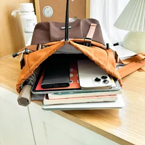 Stylish color-block casual backpack for daily commute and travel, large capacity school bag.
