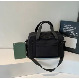 Black minimalist travel duffel bag with spacious capacity, versatile fitness gym bag for travel.