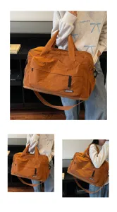 Detail view of large capacity fitness travel bag showing multi-angle carrying design.