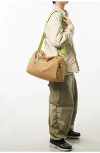 Detailed view of the casual two-tone fitness duffel bag with neon green straps and spacious interior.