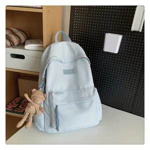 Lässiger hellblauer Schulrucksack für Schüler, einfacher Alltags-Tagesrucksack mit Fronttasche.
