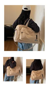 Details view of the large capacity travel fitness gym bag in beige with shoulder strap.