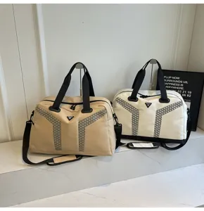 Large capacity travel duffel bag showing durable straps and stylish geometric details.