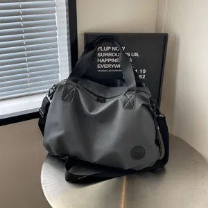 Large capacity nylon travel shoulder bag, casual tote handbag for women commuting.