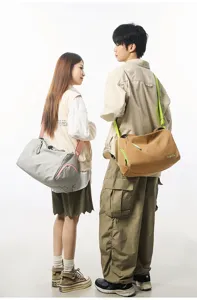 Detail view of stylish color block travel duffel bag and gym bag for casual daily sports.