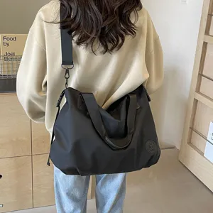 Casual large capacity nylon shoulder bag for women, commuter travel crossbody tote bag.