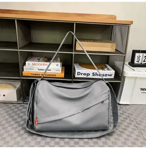 Grey waterproof sports duffel bag for gym, travel and fitness casual daily use.
