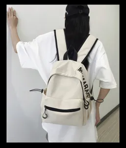 Minimalist solid color canvas backpack for women school casual daily use stylish bag.
