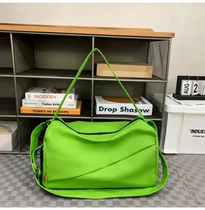 Bright green casual cross-body gym bag detail, featuring durable zipper and wide strap.