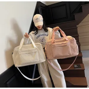 Large capacity travel duffel bag, versatile gym bag with adjustable strap for sports and trips.