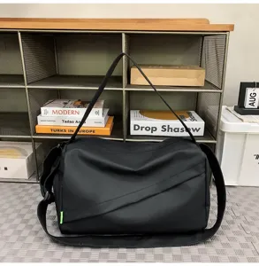 Black sports fitness duffel bag, waterproof nylon casual cross-body travel shoulder bag.