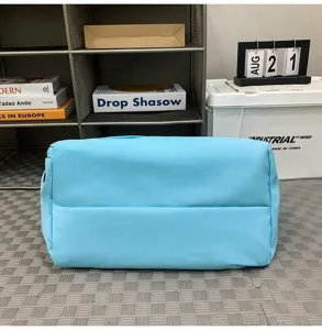 Lightweight blue sports gym bag for fitness, swimming, and travel with water-resistant fabric.