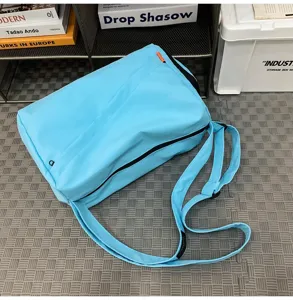 Lightweight casual sports fitness travel bag in light blue, water-resistant design.