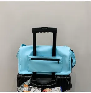 Lightweight travel duffel bag with luggage sleeve, water-resistant gym bag for short trips.