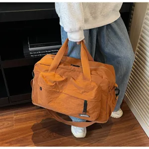 Large capacity gym travel duffel bag with shoulder strap, orange waterproof sports bag.