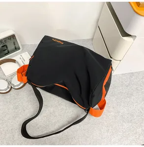 Black orange color block yoga duffle bag detail, multi-functional travel shoulder bag.