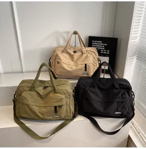 Large capacity travel gym bag with multiple pockets and durable shoulder strap for sports fitness.