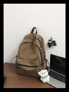 Casual minimalist canvas school backpack for women, stylish student daily daypack.