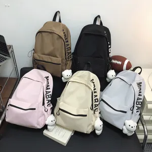 Korean style solid color casual backpack student school bag with cute bear pendant for daily use