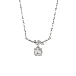 Exquisite square diamond pendant necklace featuring geometric lines and delicate knot design.