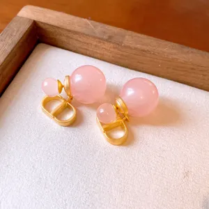 Pink double ball earrings with gold tone designer logo style, sweet and elegant jewelry accessory