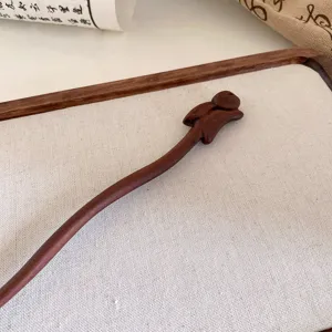 Handcrafted wooden hair stick with cute animal carving, retro Chinese style hair accessory.