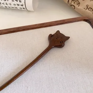 Exquisite wooden hair stick with cute animal carving, retro Chinese style hair accessory for women.