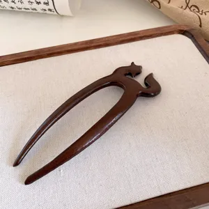 Unique wooden hair fork with creative animal design, vintage style hair accessory for women.
