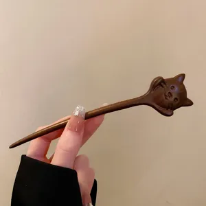 Retro wooden hair stick with cute animal carving, minimalist Chinese style hair accessory.