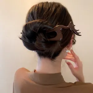 Elegant wooden hair stick with a chic deer design, perfect for elegant retro hairstyles.