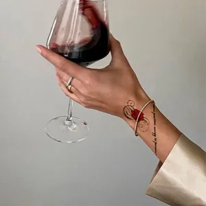 Temporary waterproof tattoo sticker featuring red rose and inspirational text design.