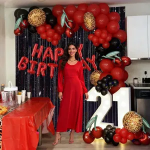 Retro cherry balloon arch kit with red black and leopard print for birthday party decor.