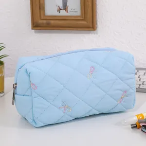 Light blue quilted cosmetic bag with cute embroidered bows, portable large capacity travel pouch.